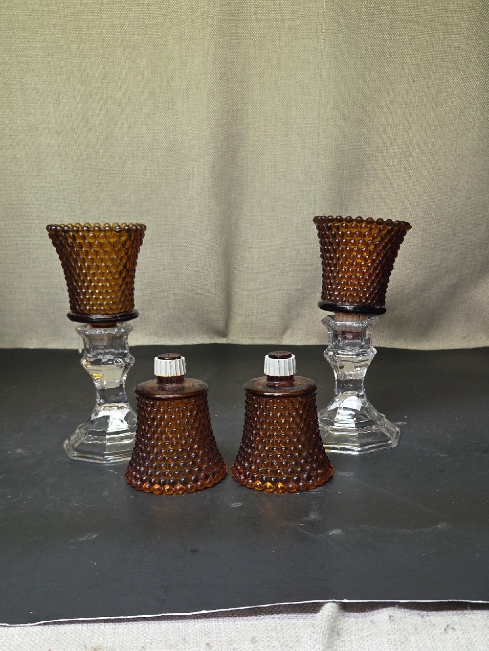 4 vintage Home Interior amber glass hobnail peg votive candle holders.